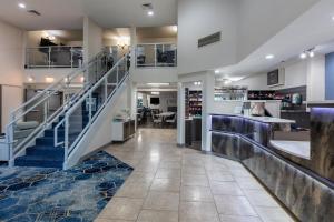 a hallway with a staircase in a building at Holiday Inn Express Spokane-Valley by IHG in Spokane Valley