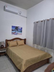 Postel nebo postele na pokoji v ubytování Casa da Vila Boipeba