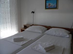 Postel nebo postele na pokoji v ubytování Apartments Horizont