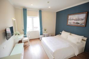 Postel nebo postele na pokoji v ubytování Hotel Du Lys