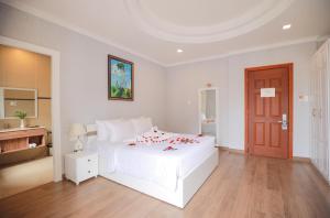 Postel nebo postele na pokoji v ubytování Hotel Du Lys