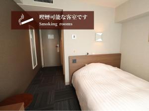 Silk Hotel Annex客房内的一张或多张床位