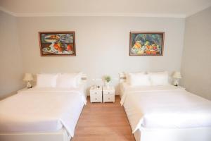 Postel nebo postele na pokoji v ubytování Hotel Du Lys