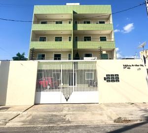 a building with a gate in front of it at Edificio Artur Regis in Petrolina