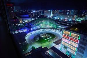 a view of a building at night with lights at Hotel Kanazawa in Kanazawa