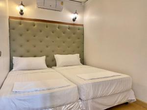 Postel nebo postele na pokoji v ubytování Marc Hotel Maesai