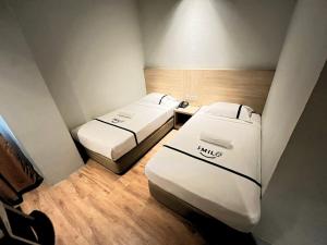 Postel nebo postele na pokoji v ubytování Sky Hotel Chow Kit PWTC