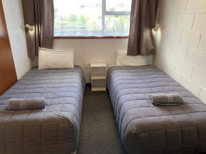 Postel nebo postele na pokoji v ubytování Cumberland Motel