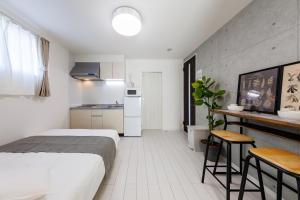 Køkken eller tekøkken på しっぽタウンホテル岸里駅