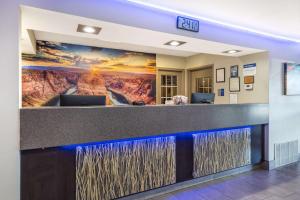 an office lobby with a painting of a mountain at Best Western McCarran Inn in Las Vegas +35 photos
