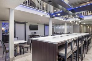 a conference room with a long table and chairs at Best Western McCarran Inn in Las Vegas