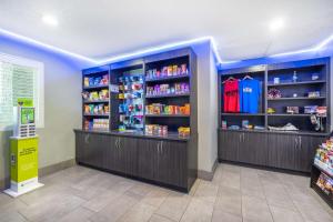 a store aisle with shelves of food and drinks at Best Western McCarran Inn in Las Vegas