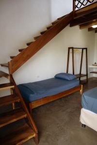 Postel nebo postele na pokoji v ubytování Gecko Hotel