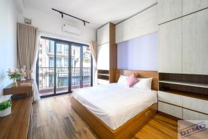 Ένα ή περισσότερα κρεβάτια σε δωμάτιο στο Luxe Paradise Residence 88 Tu Hoa