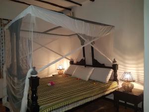 The Foxy Nests of Karibuni - Villa 184 & 145客房内的一张或多张床位