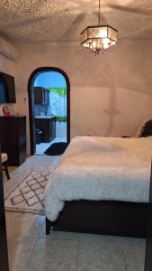 Postel nebo postele na pokoji v ubytování Mandeville Hideaway
