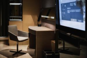 TV in/ali zabaviščno središče v nastanitvi Grand Metropark Hotel Shanghai Pudong