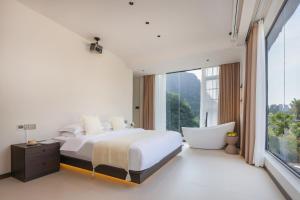 THAT MAY Hotel客房内的一张或多张床位