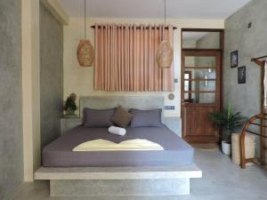 a bedroom with a large bed in a room at Sandbank Madiha deluxe bedroom with private bathroom in Matara