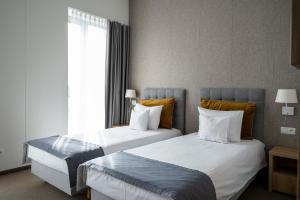 Postel nebo postele na pokoji v ubytování Hotel Arkadia Jelcz-Laskowice