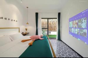 Letto o letti in una camera di Xiamen Mingshu Shanqiu Homestay