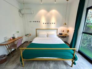 Letto o letti in una camera di Xiamen Mingshu Shanqiu Homestay