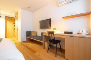 Tempat tidur dalam kamar di Dash Living Gojo