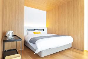 Tempat tidur dalam kamar di Dash Living Gojo
