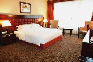 Postel nebo postele na pokoji v ubytování Grand Central Hotel