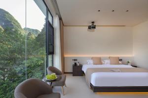 THAT MAY Hotel客房内的一张或多张床位