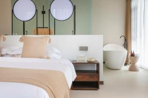 THAT MAY Hotel客房内的一张或多张床位