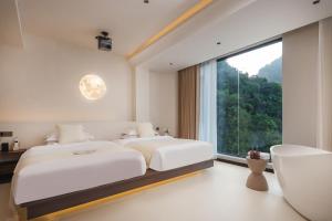 THAT MAY Hotel客房内的一张或多张床位