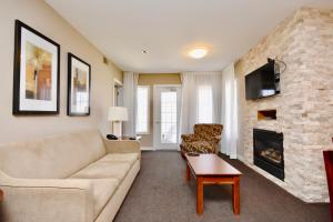a living room with a couch and a fireplace at Relaxing 2BR Retreat at Carriage Hills in Edgar