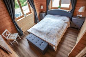 Posteľ alebo postele v izbe v ubytovaní Gemütliches Holzhaus in Gamlitz