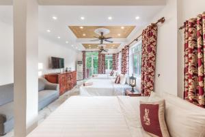 a bedroom with two beds and a couch at Residence Wat Damnak in Siem Reap +67 photos