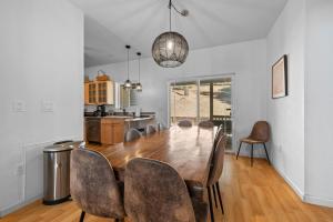 a dining room with a wooden table and chairs at Zen Whisper in the Woods in Groveland