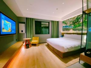 Posteľ alebo postele v izbe v ubytovaní Qiuguo Hotel Chongqing Guanyin Bridge Branch