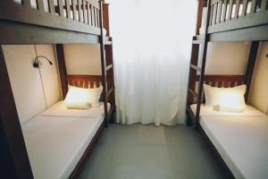 Postel nebo postele na pokoji v ubytování Island Diaries Hostel
