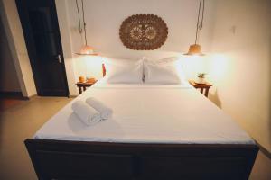 Postel nebo postele na pokoji v ubytování Island Diaries Hostel