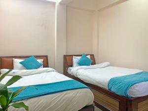 Una cama o camas en una habitación de Hotel Resunga Arjun