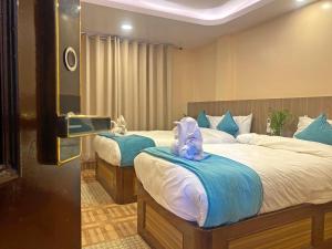Una cama o camas en una habitación de Hotel Resunga Arjun
