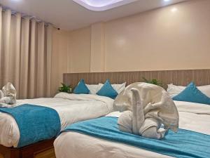 Una cama o camas en una habitación de Hotel Resunga Arjun