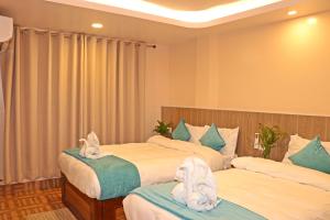 Una cama o camas en una habitación de Hotel Resunga Arjun