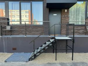 a staircase on the side of a building at Chic Residence apartament 2 in Šiauliai