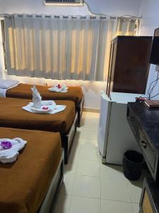 TV a/nebo společenská místnost v ubytování Oscar Hotel