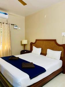 Nasya Beachside Cottages客房内的一张或多张床位