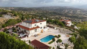 an aerial view of a house with a swimming pool at Letymvou Terrace in Letimbou
