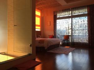Postel nebo postele na pokoji v ubytování Jing Xiang Hua Nong B&B