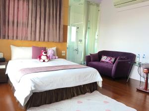 Postel nebo postele na pokoji v ubytování Jing Xiang Hua Nong B&B
