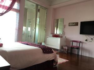 Postel nebo postele na pokoji v ubytování Jing Xiang Hua Nong B&B
